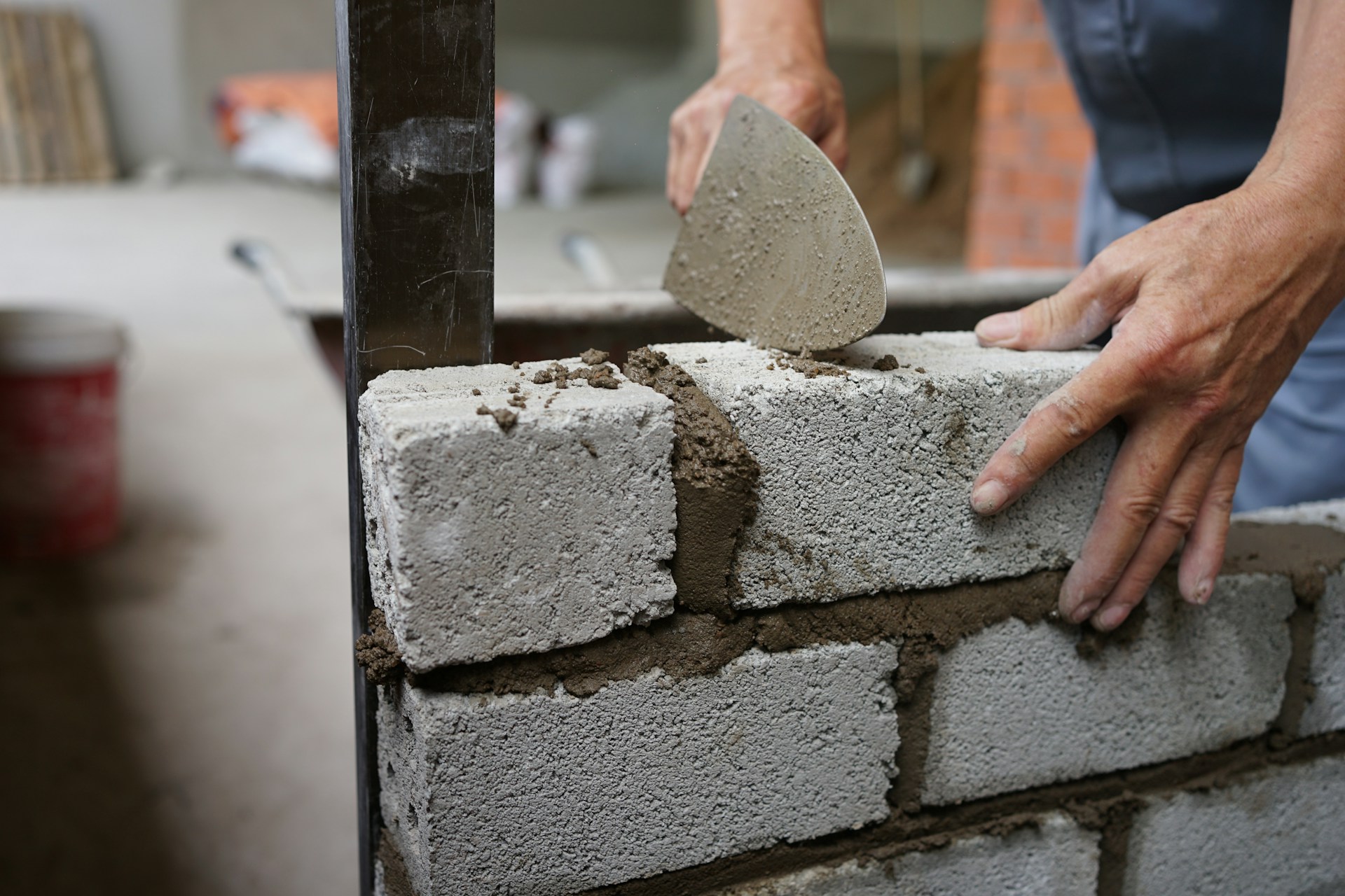 man laying bricks